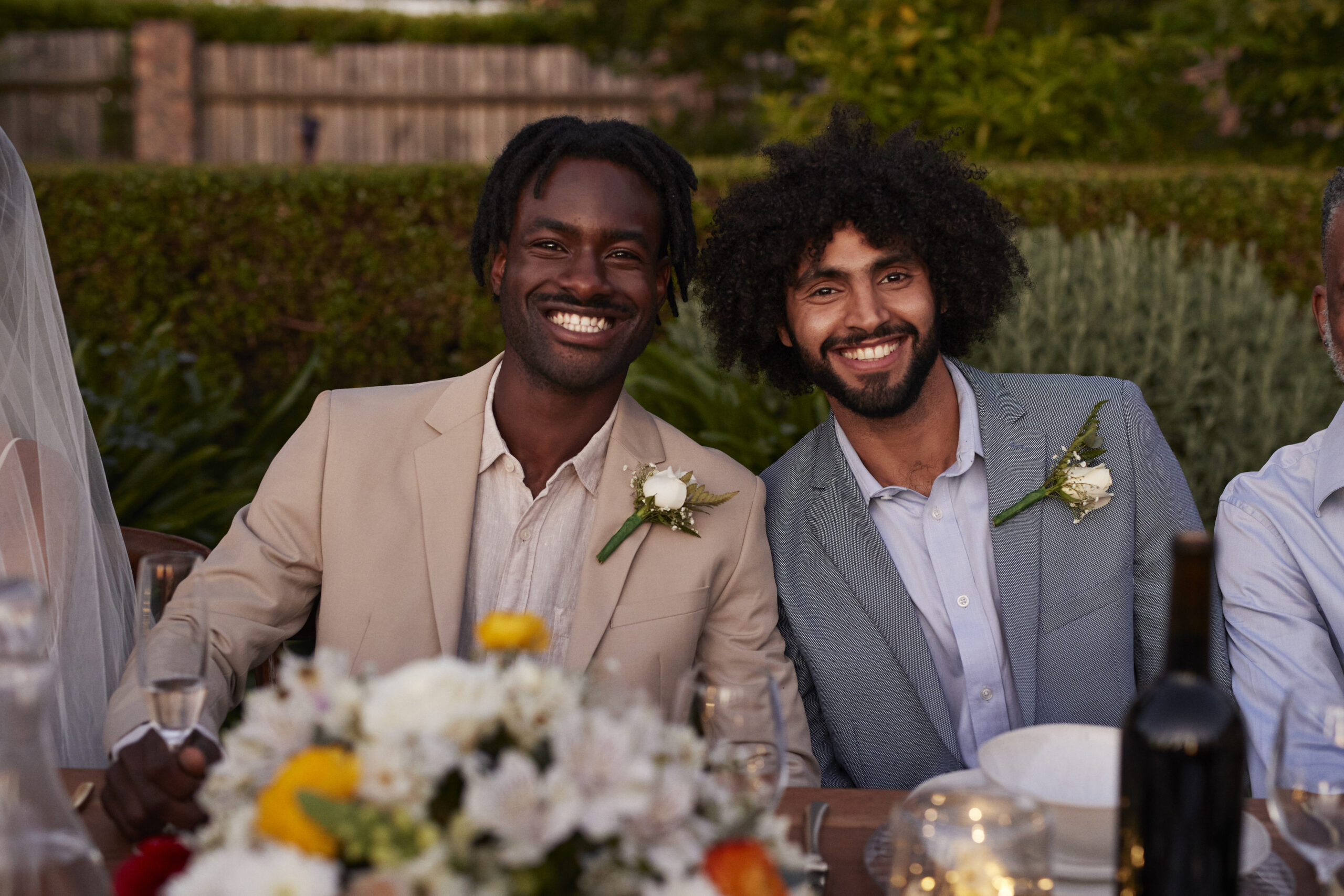 groom and best man sitting at table