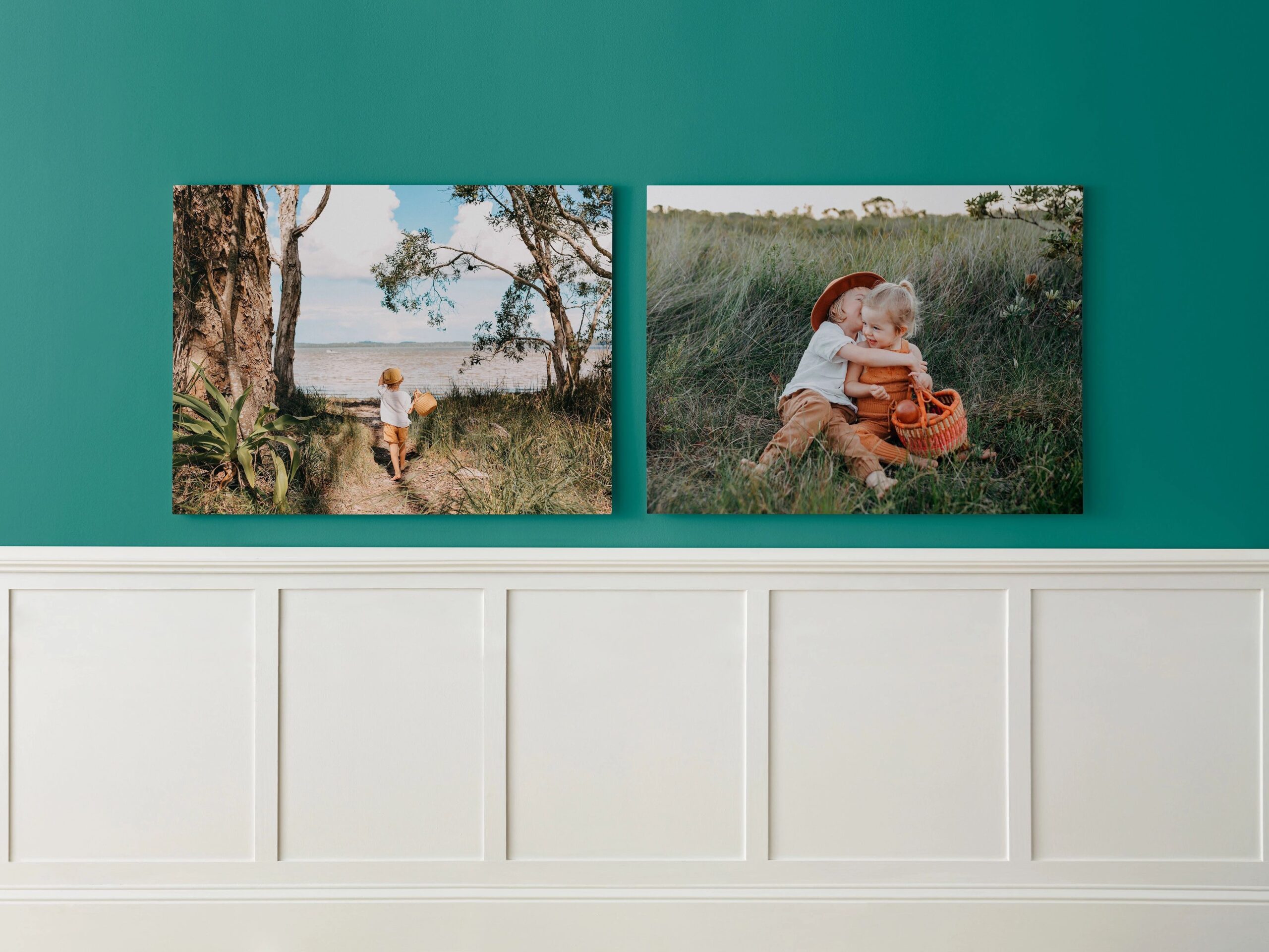 two metal prints hanging on the wall
