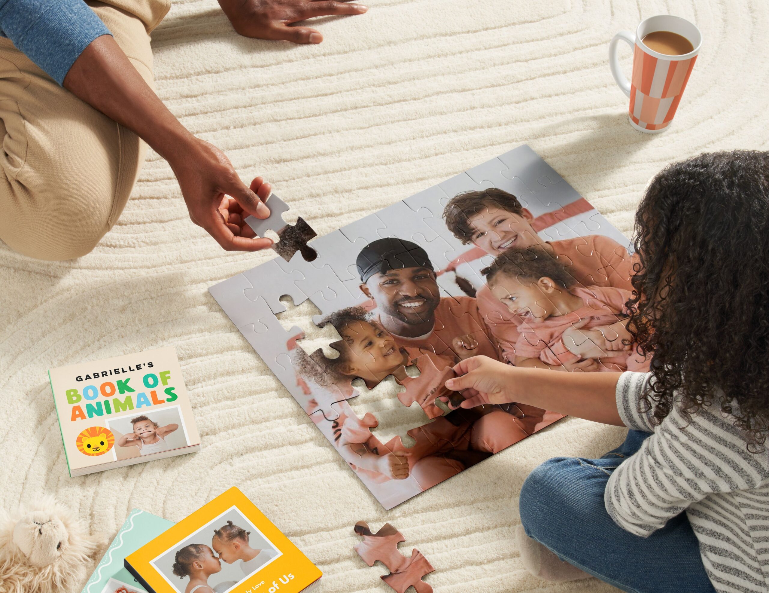 little girl doing a jigsaw puzzle with her dad