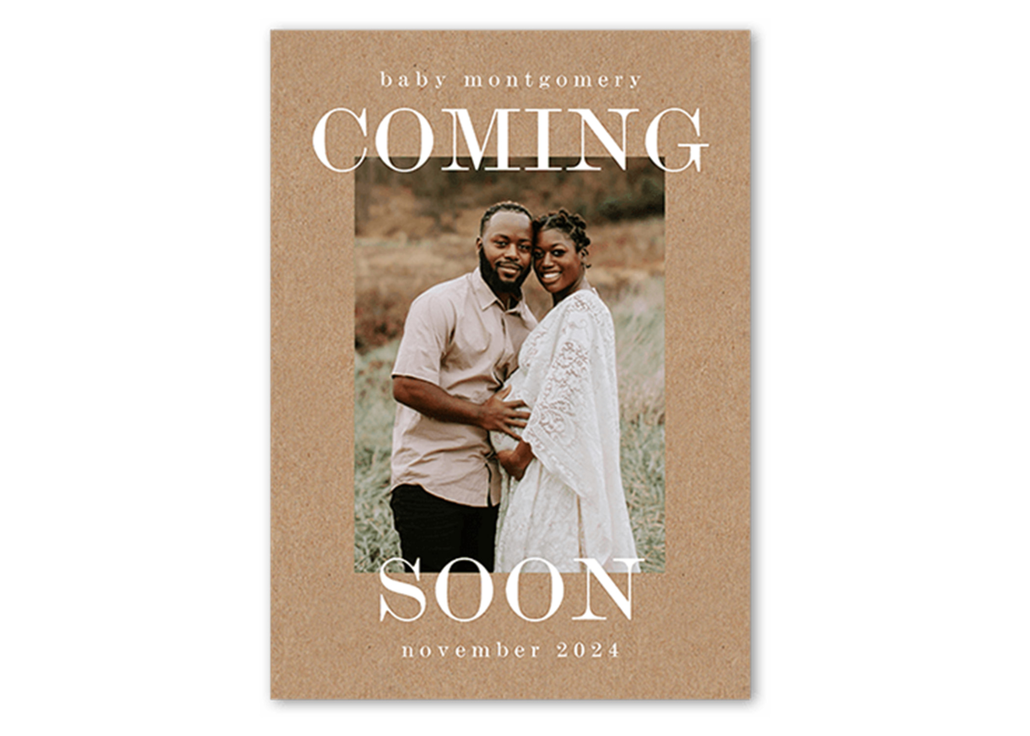 a couple sharing the news of their pregnancy on an announcement card
