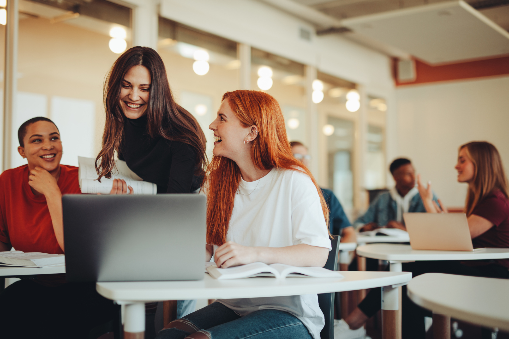 women in classroom smiling