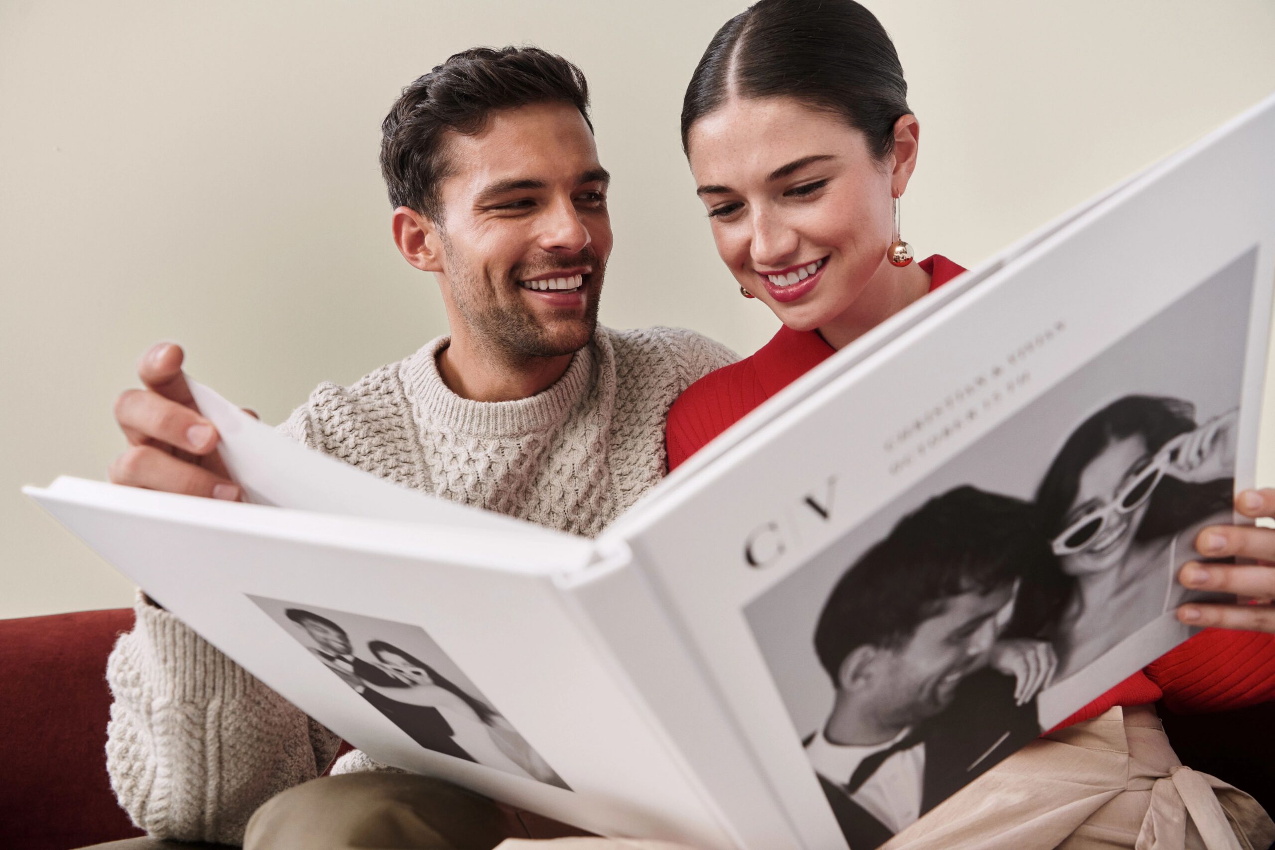 couple looking at wedding photo book together