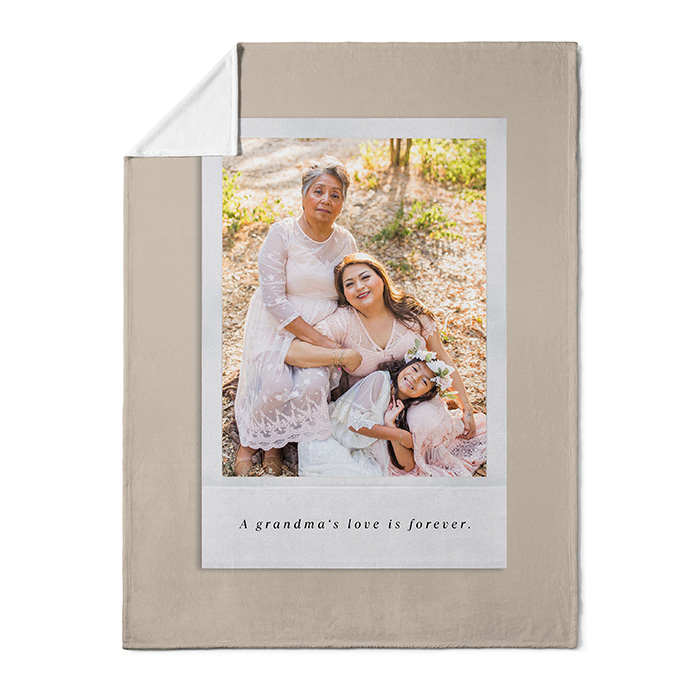 photo blanket with a picture of a grandma, daughter, and grandchild